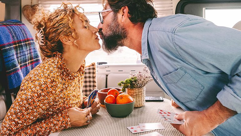 happy couple playing cards photo
